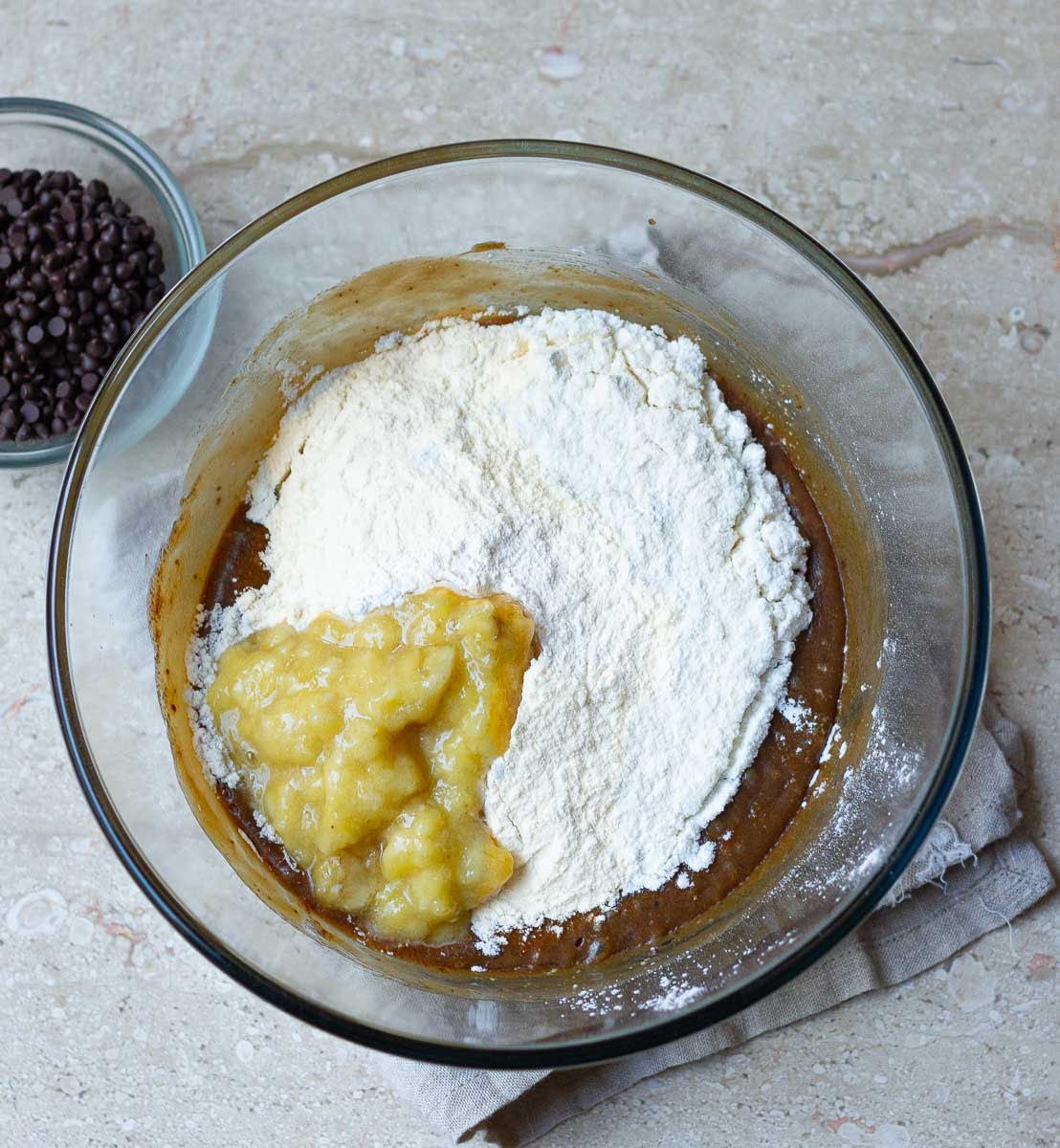 Flour and mashed banana in the wet ingredients bowl