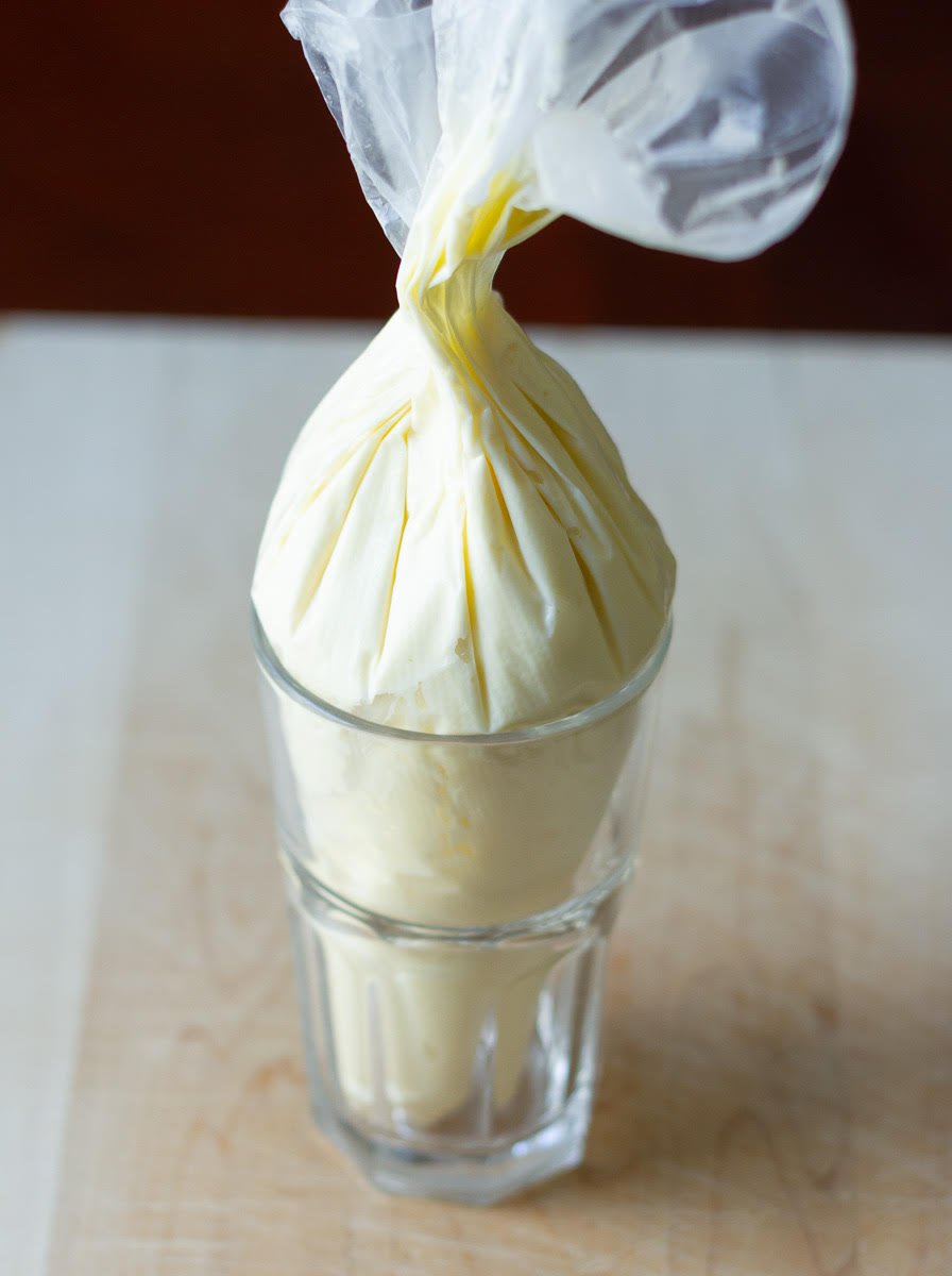 cream cheese filling in a piping bag