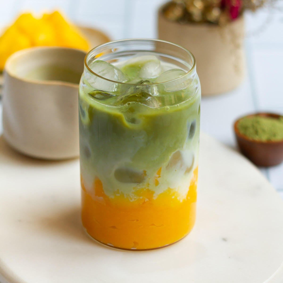 Mango Matcha Latte in a glass.