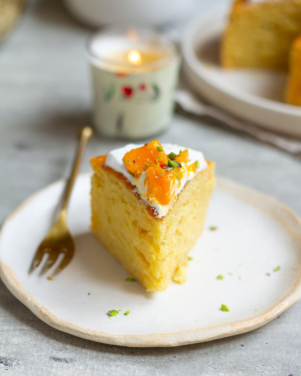 A slice of mango cake on a plate