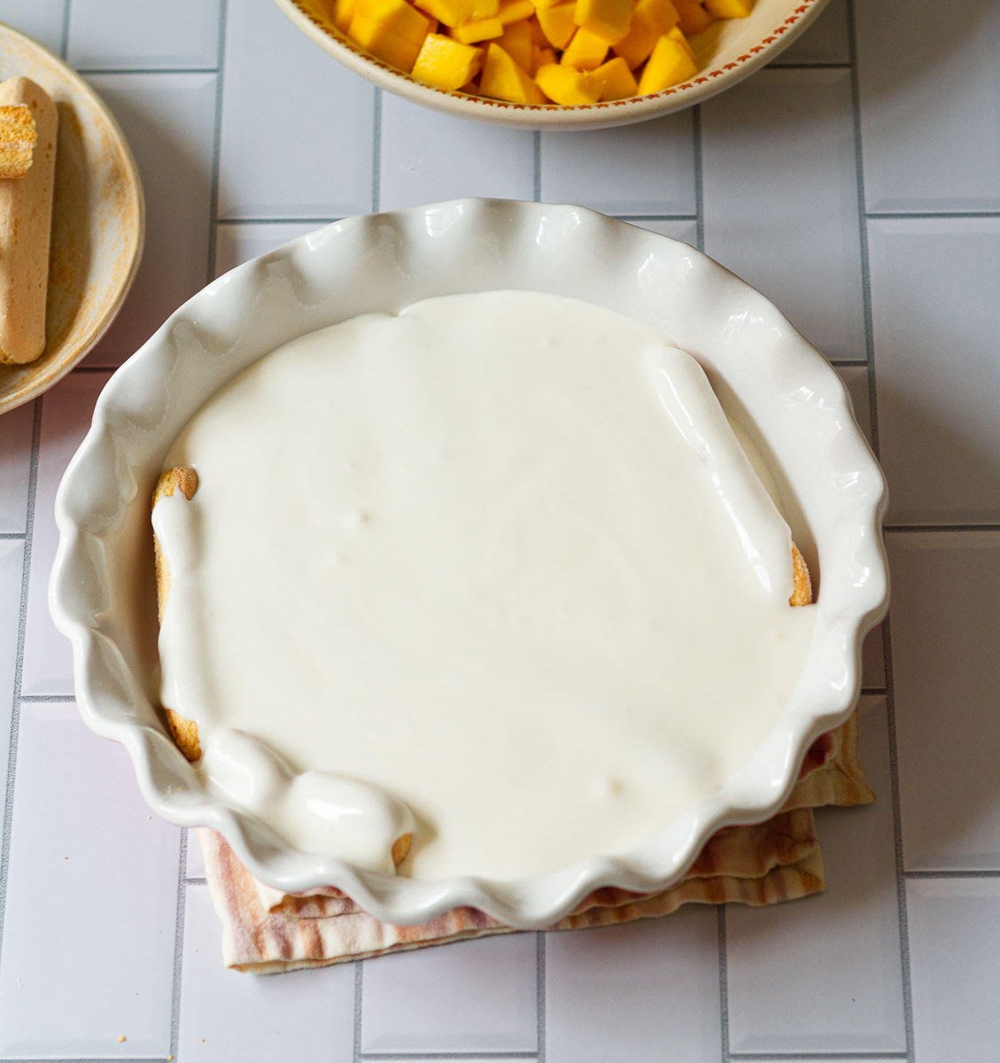 Layer of cream on top of the cookies.