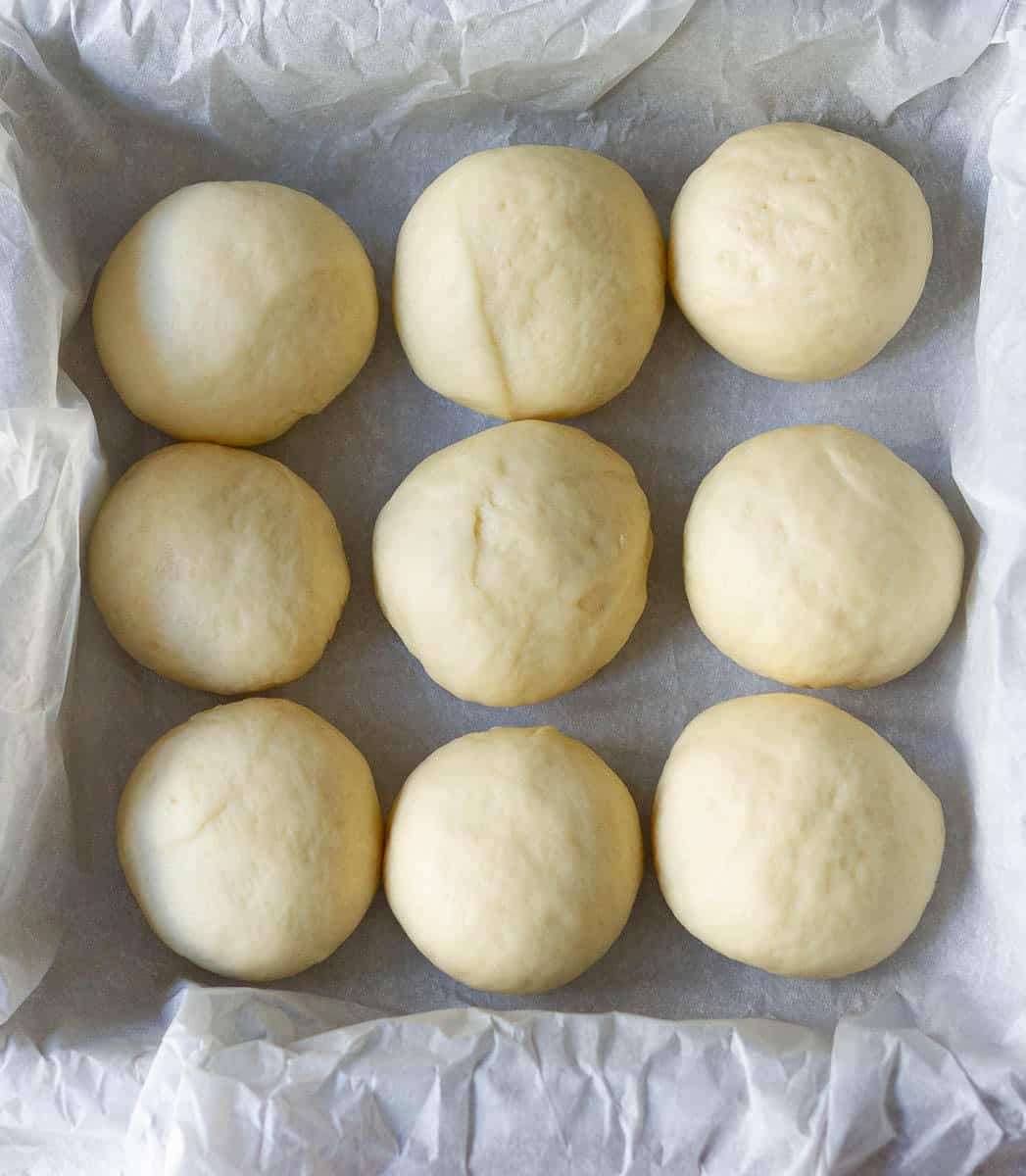 place the dough balls in a pan and let rise 2nd time