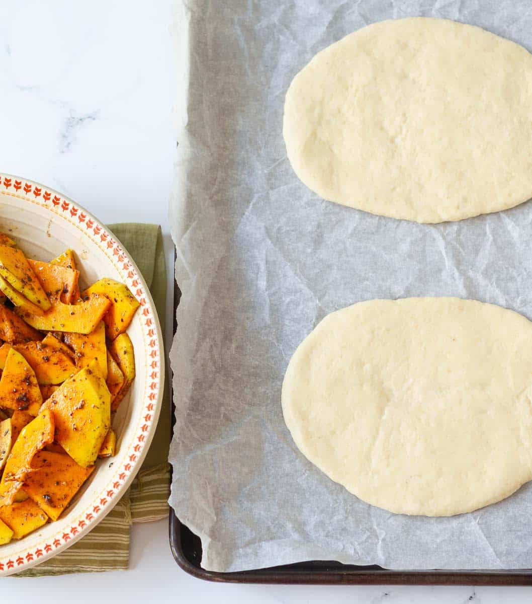 Rolled out dough and seasoned squash