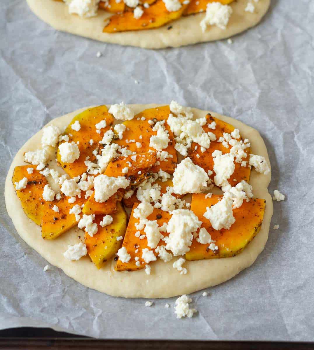 seasoned butternut squash and feta on top of the rolled out dough