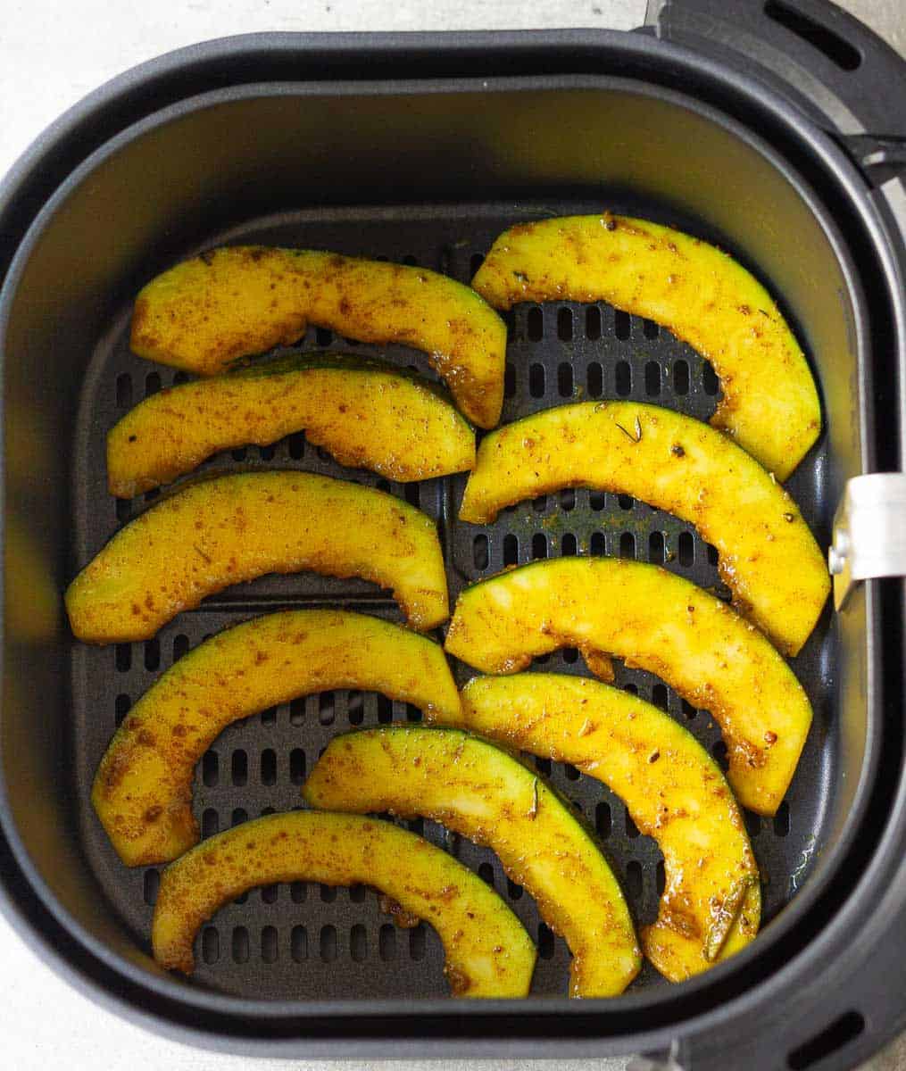 Arrange the pumpkin slices in the airfryer basket