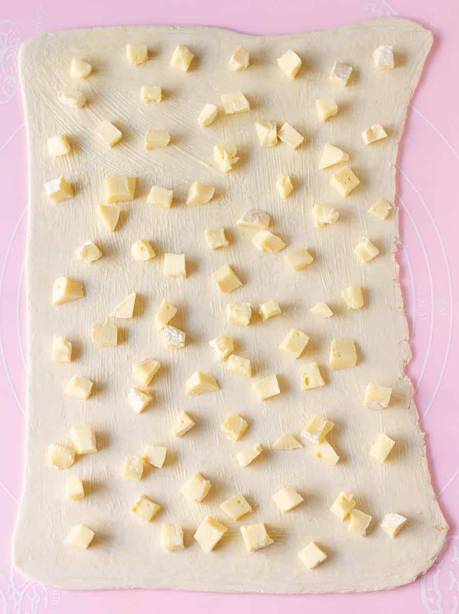 Small pieces of brie on top of the rolled out pastry.