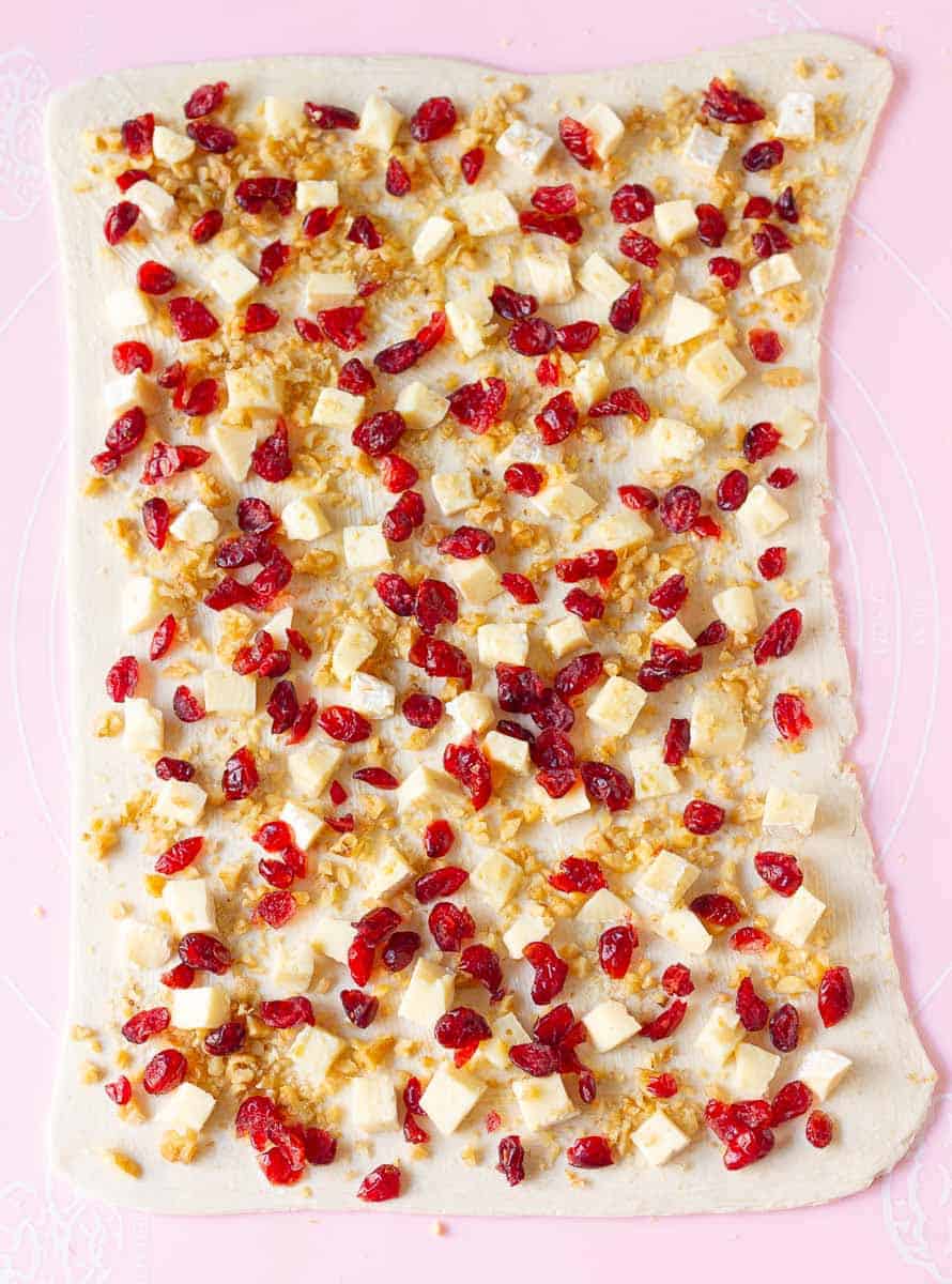 Sprinkle cranberries and walnuts on top