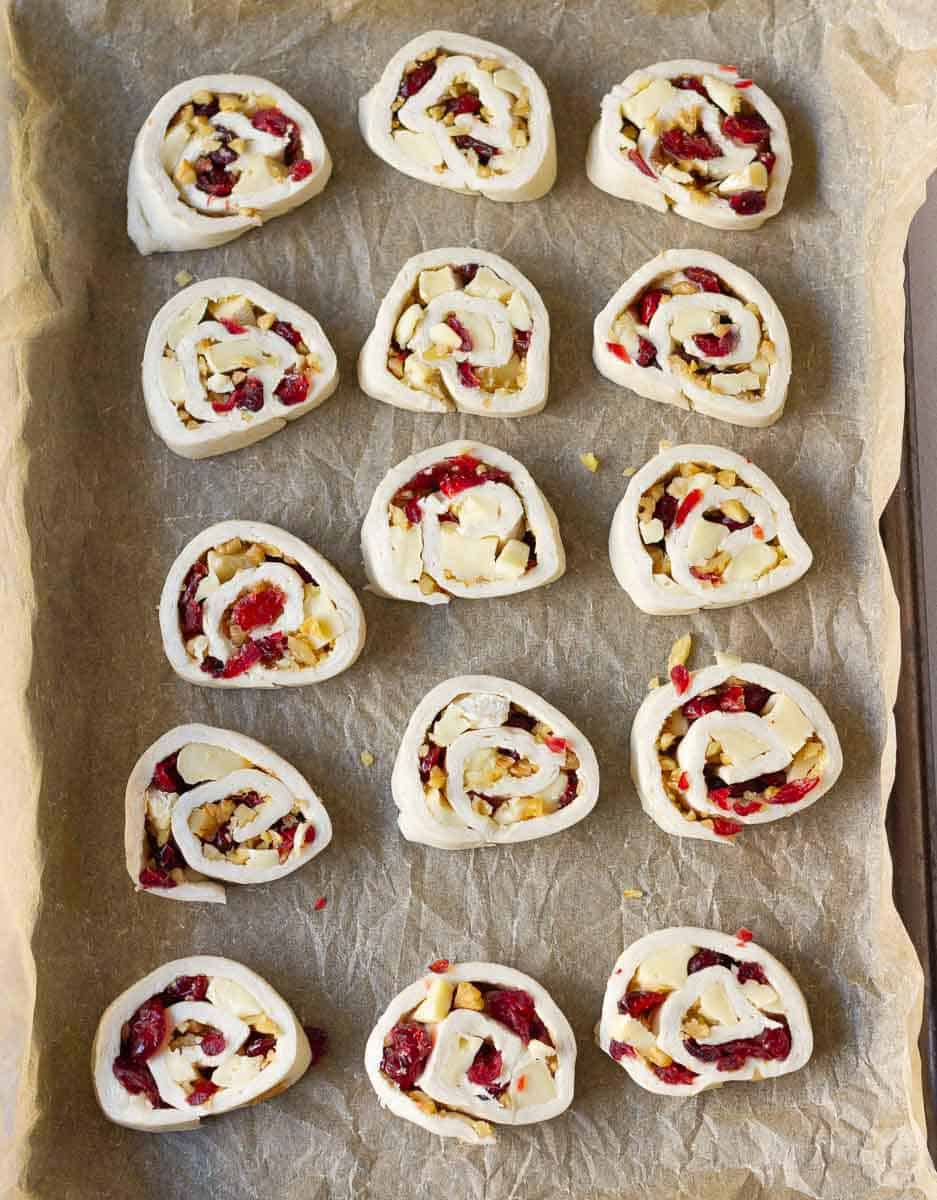 Cut pastry slices on parchment lined baking tray.