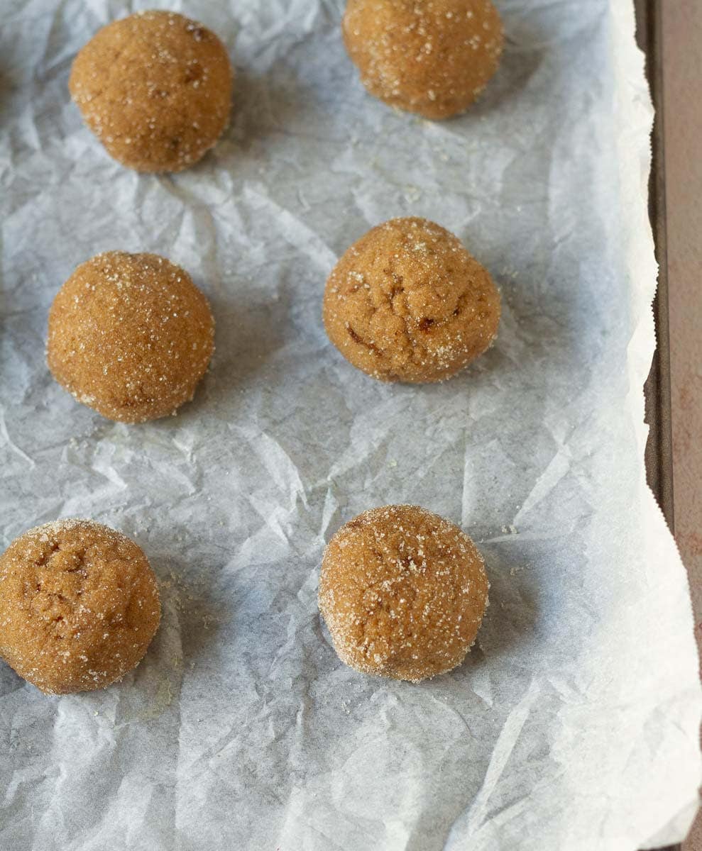 cookie dough balls coated with granulated sugar