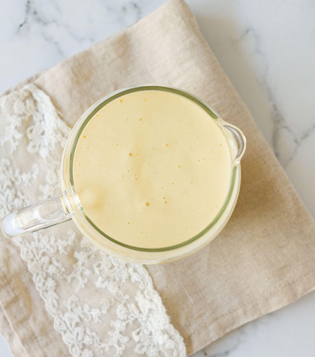Milk mixture for the cake in a pitcher.