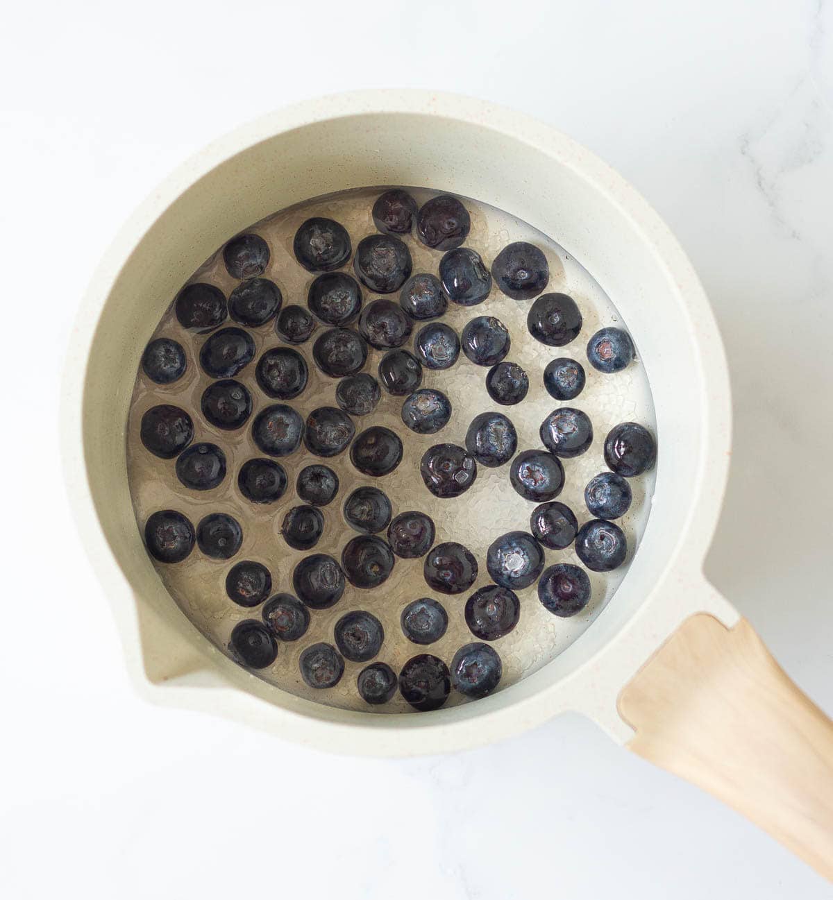 water, blueberries, and sugar in a saucepan.