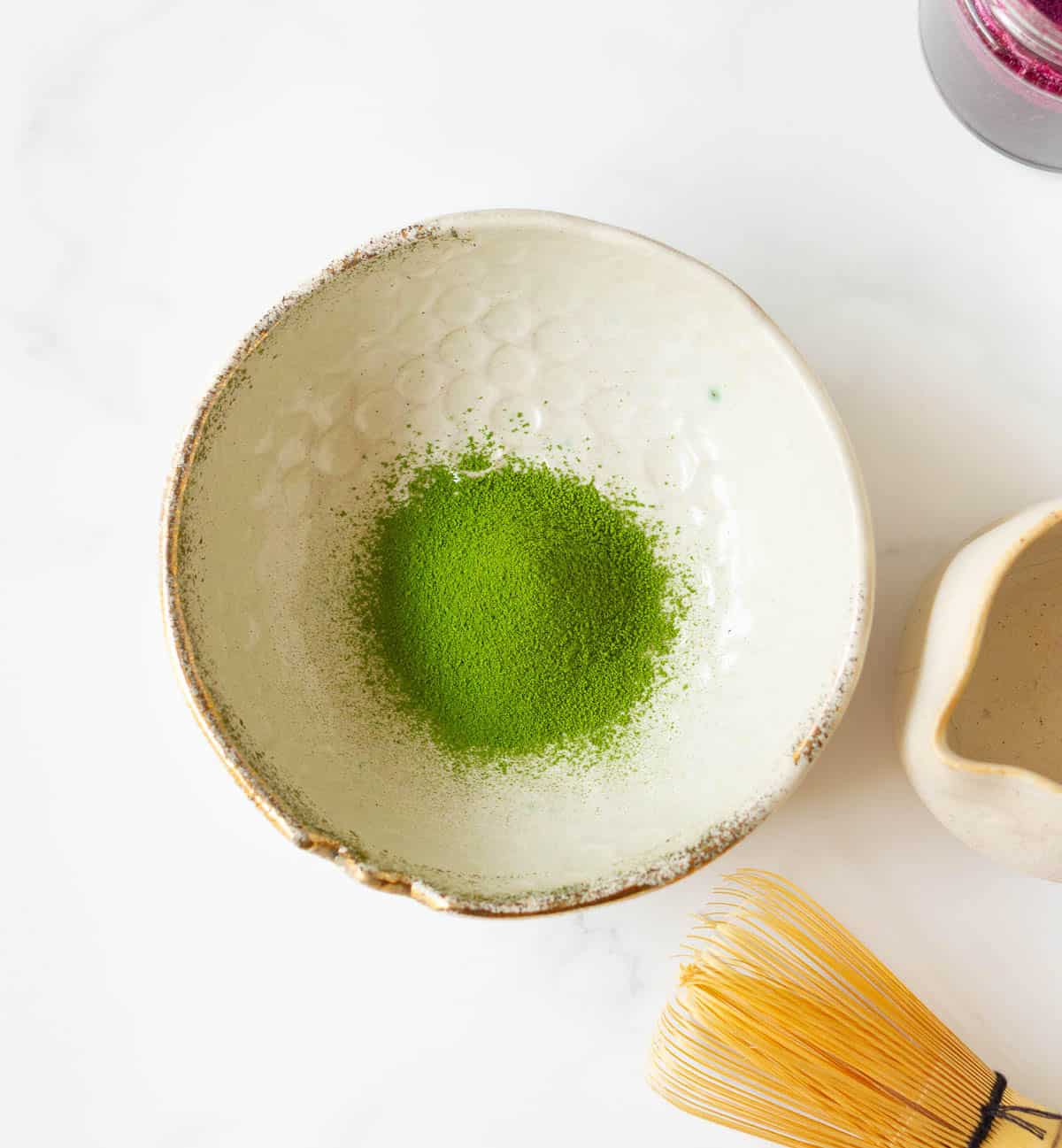 Sifted matcha powder in a small bowl.