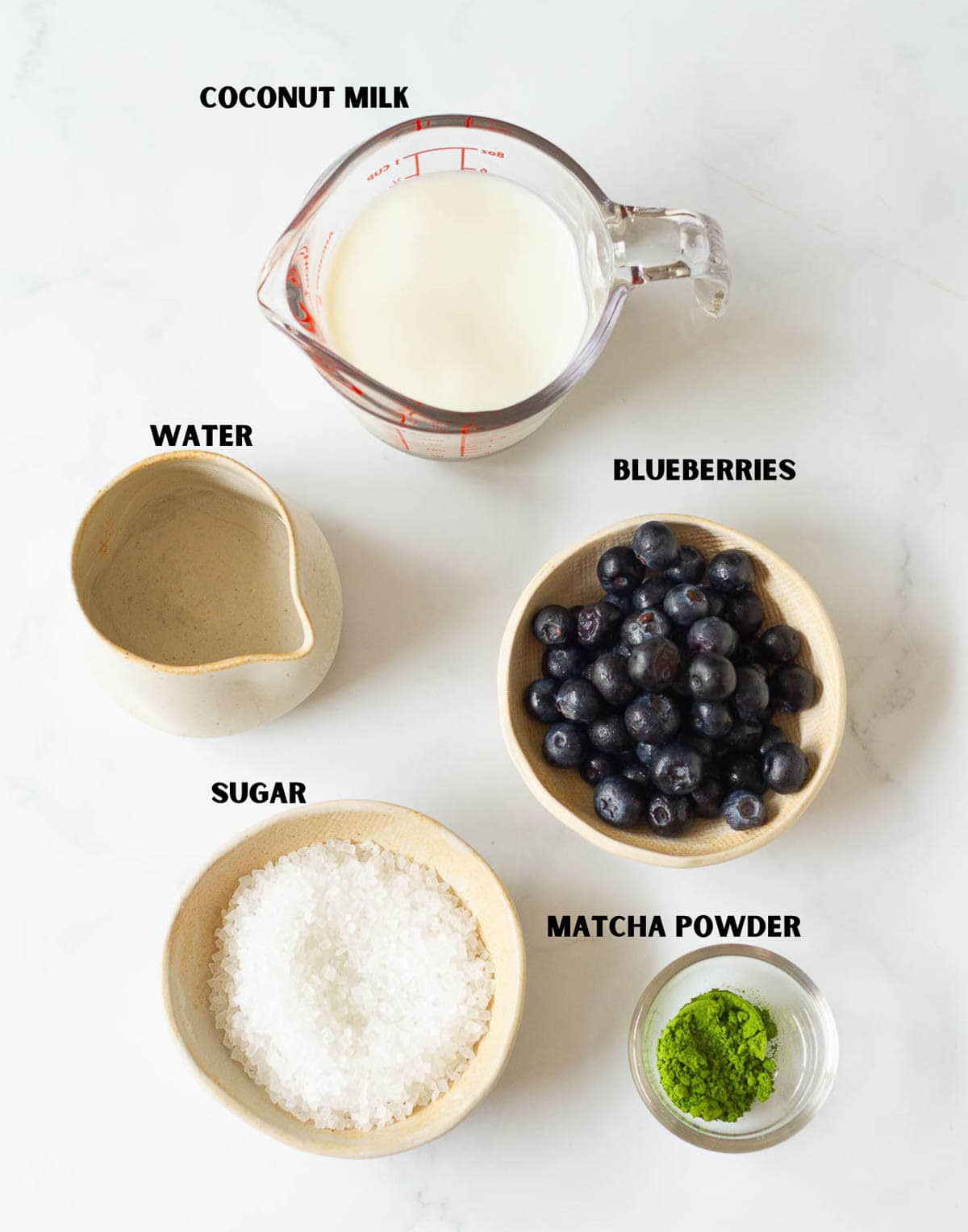 Ingredients for making blueberry matcha latte.
