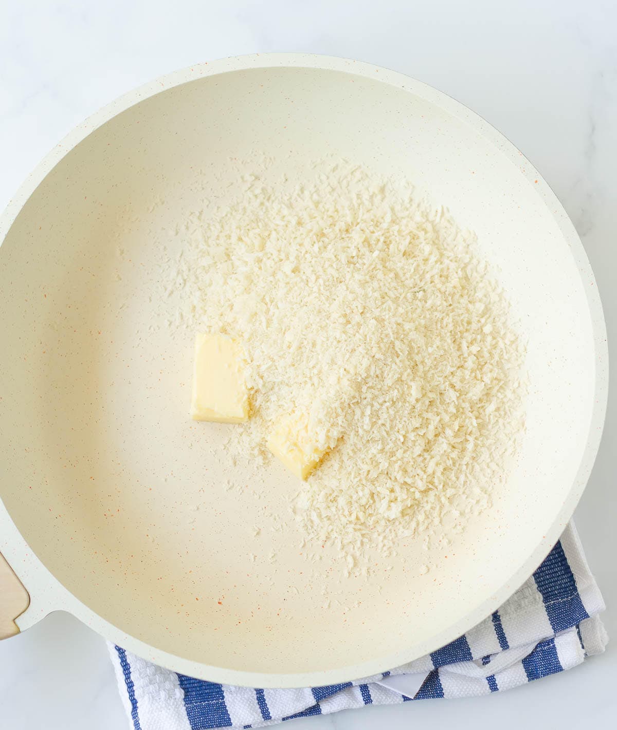 Butter and panko breadcrumbs in a saucepan.