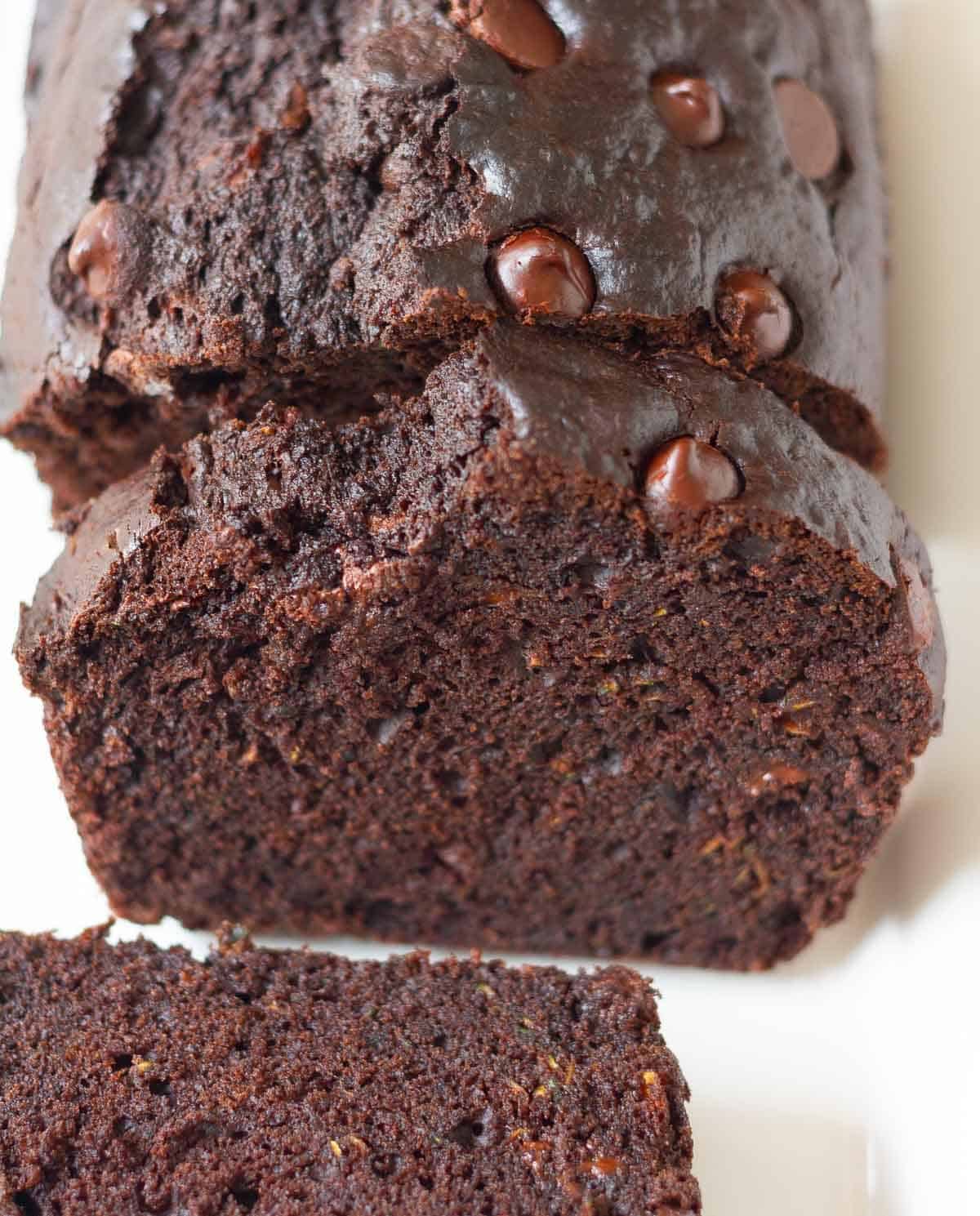 Sliced chocolate loaf cake on a platter.