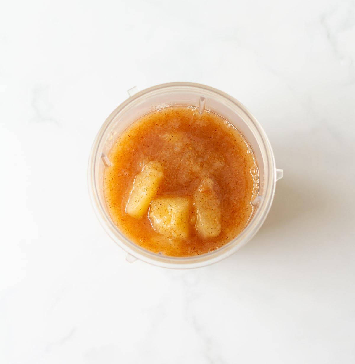 Cooked pear mixture in a blender jar.