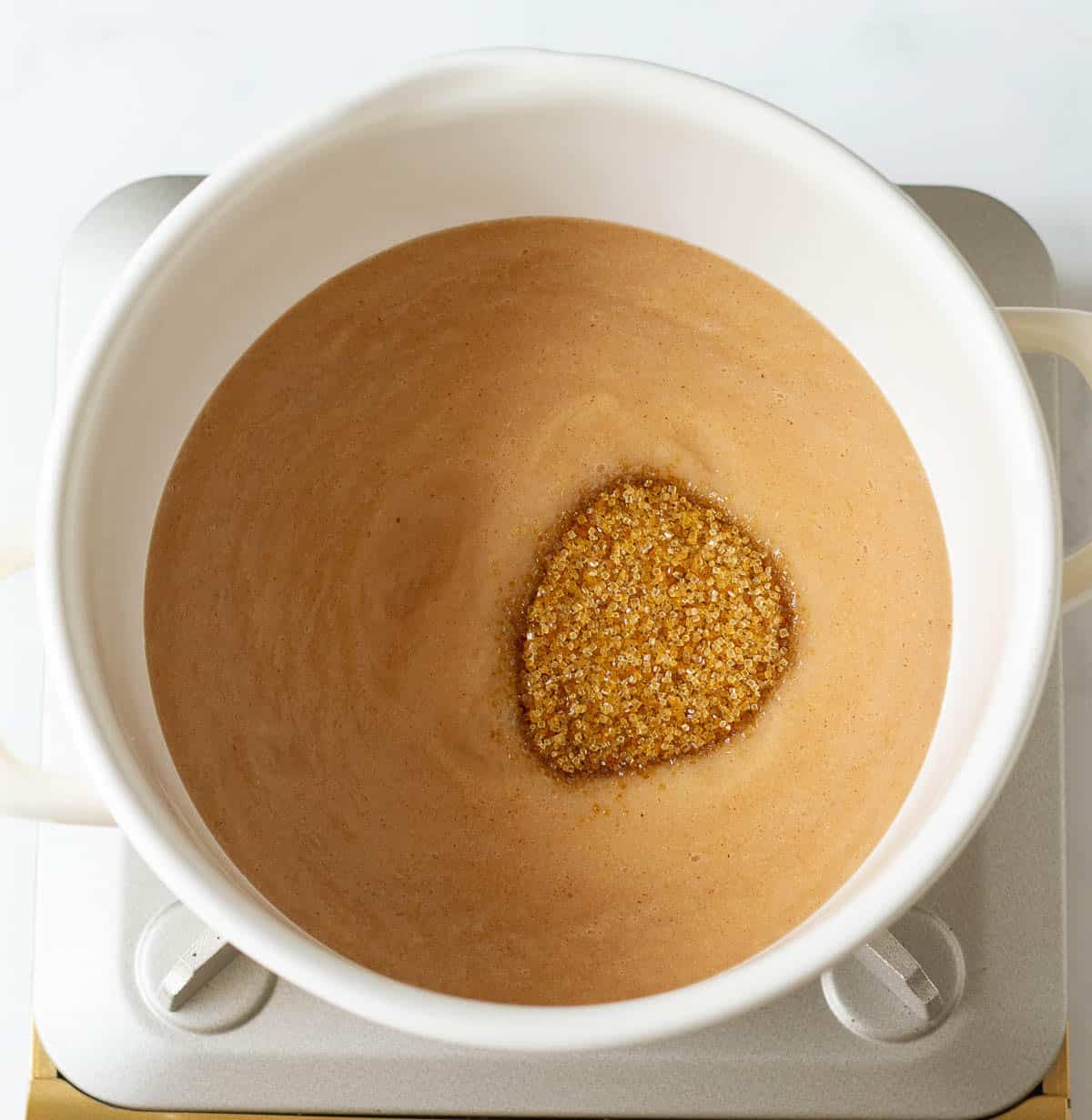 Pear puree with brown sugar in a stock pot.