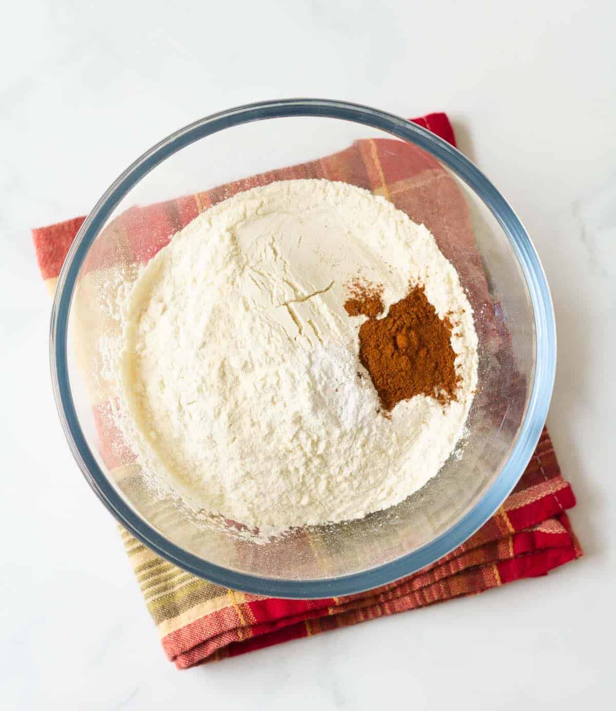 Dry ingredients for making cookies in a mixing bowl.