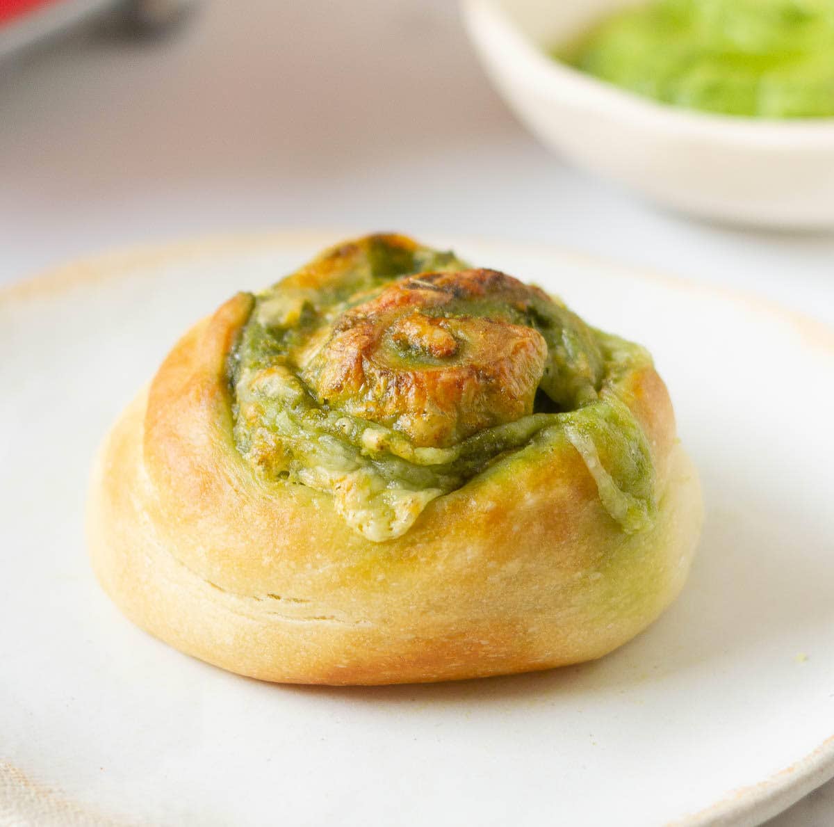 A roll on a small plate.