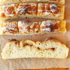 Sliced cinnamon focaccia with vanilla glaze.