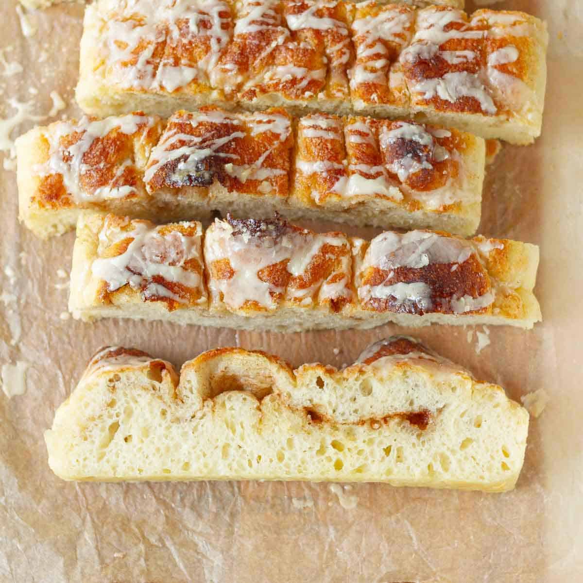 Sliced focaccia on parchment paper.