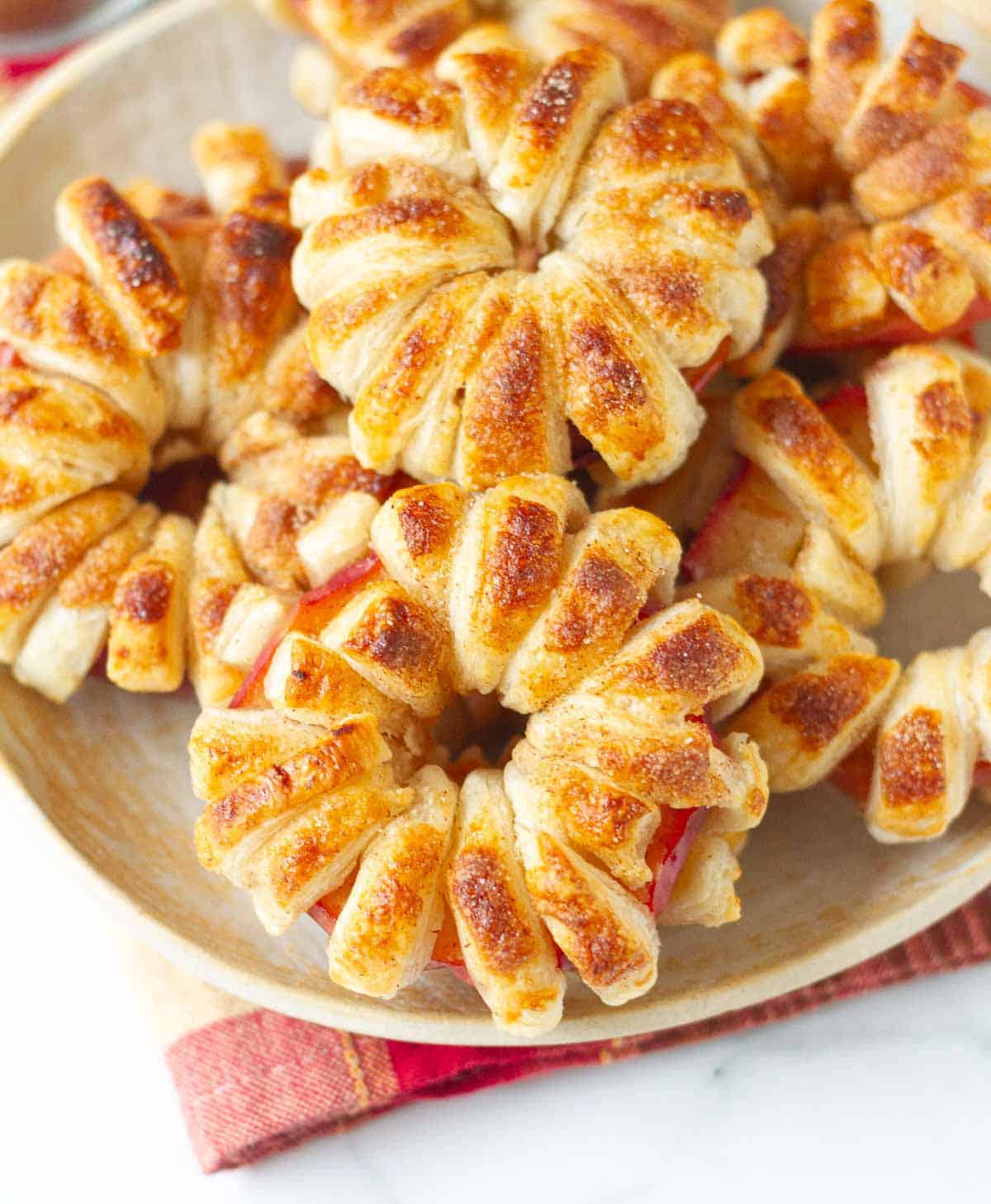 A plate full pf apple pastries.