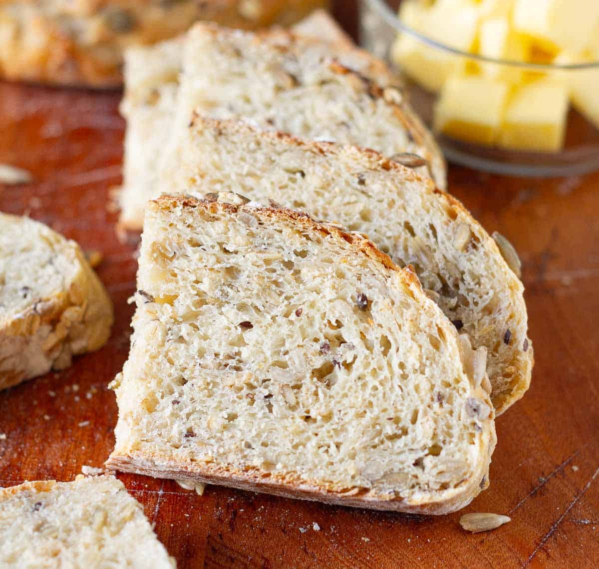 Sliced bread on a wooden board.