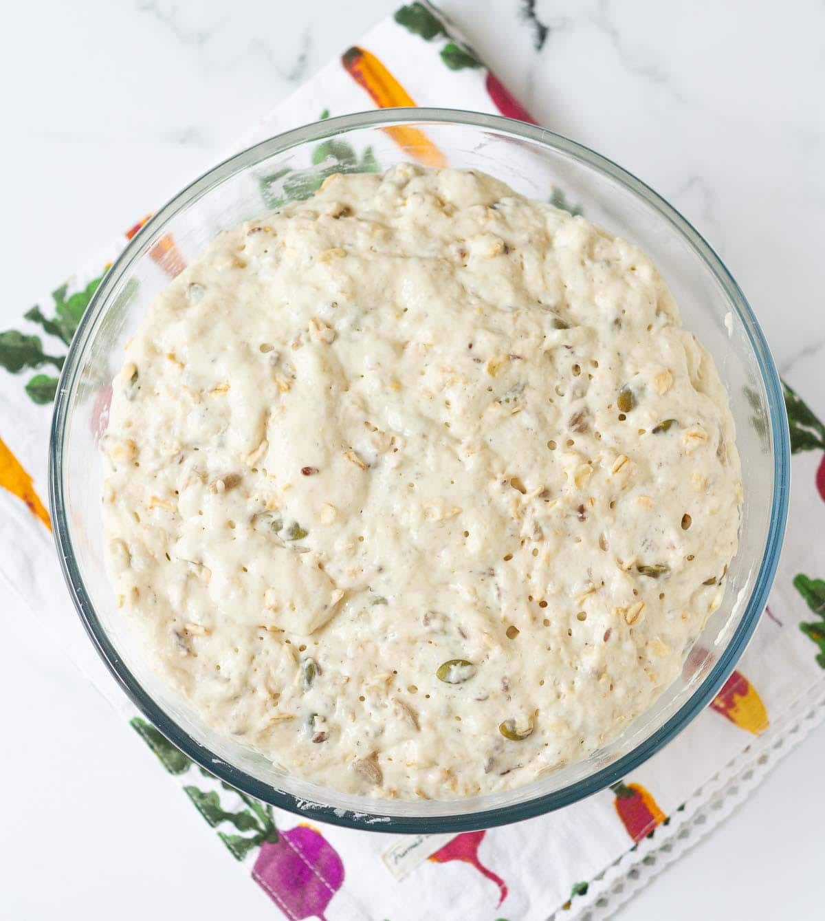 Proofed dough in a mixing bowl.