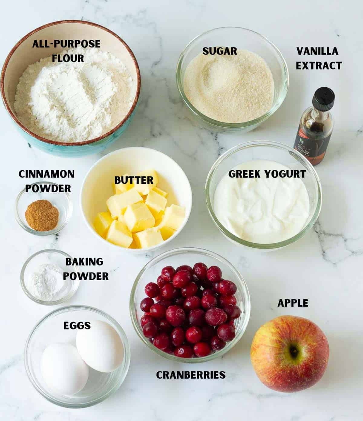 Labelled ingredients for making cranberry apple cake.