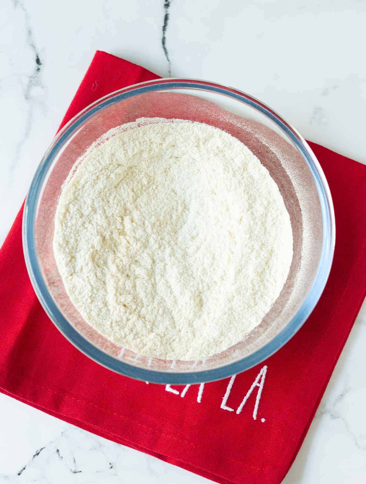 Almond flour and all purpose flour in a mixing bowl.