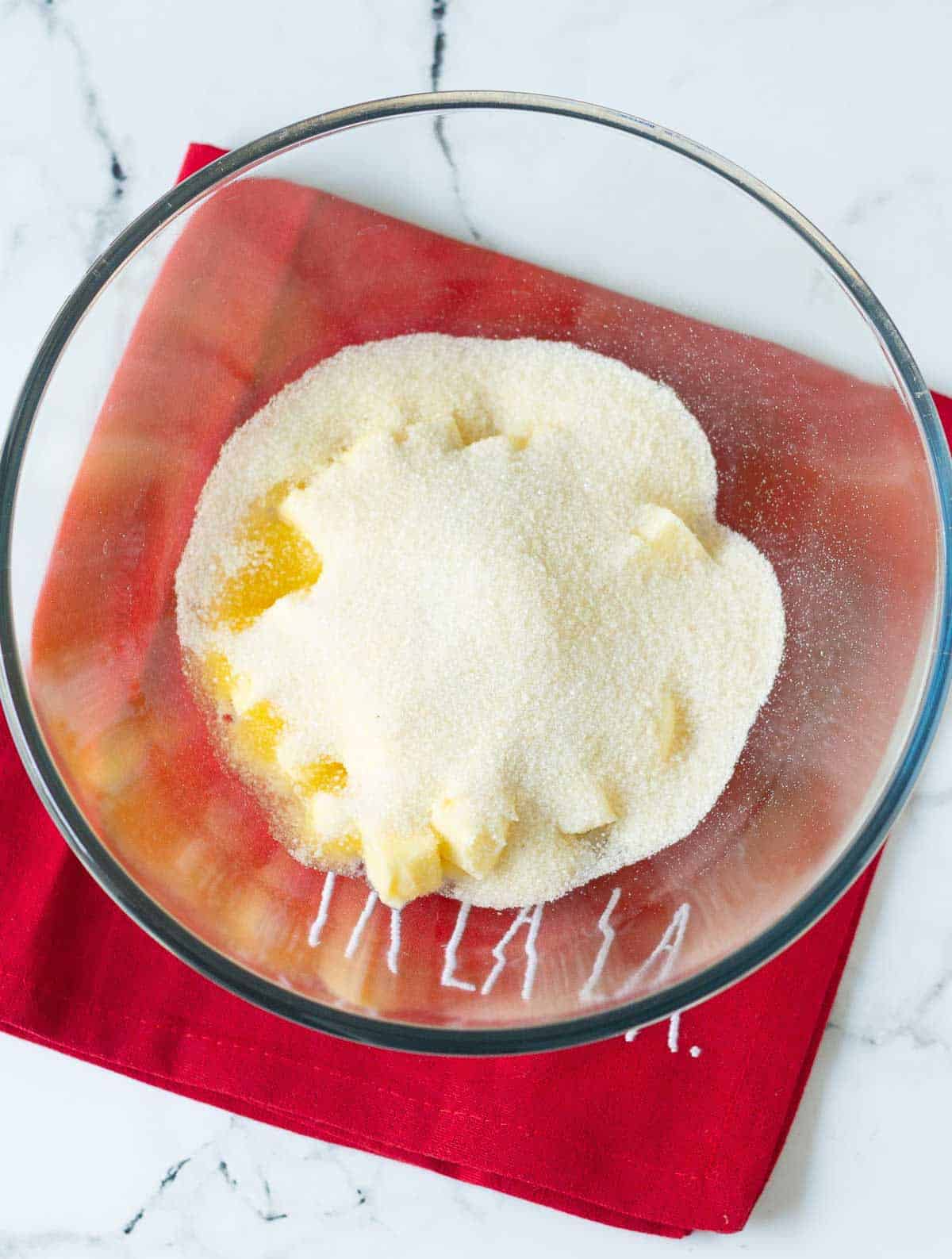 Butter and sugar in a mixing bowl.
