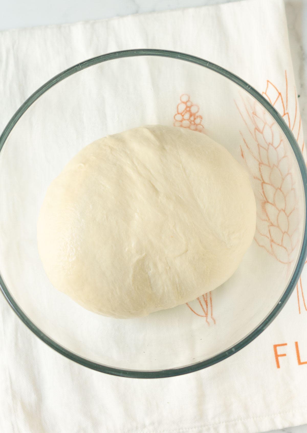 Dough in a mixing bowl.