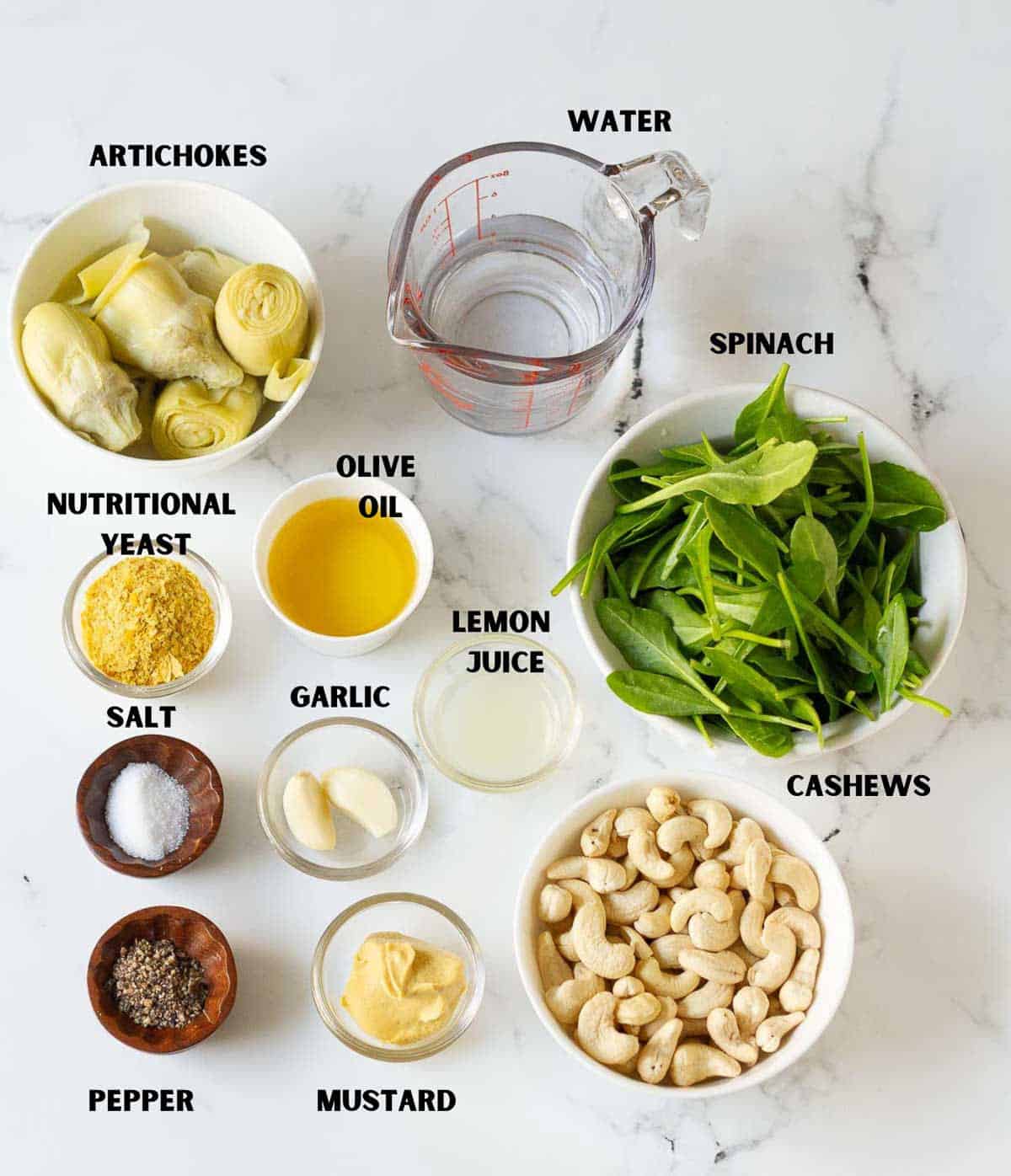 Labelled ingredients used for making spinach artichoke dip.