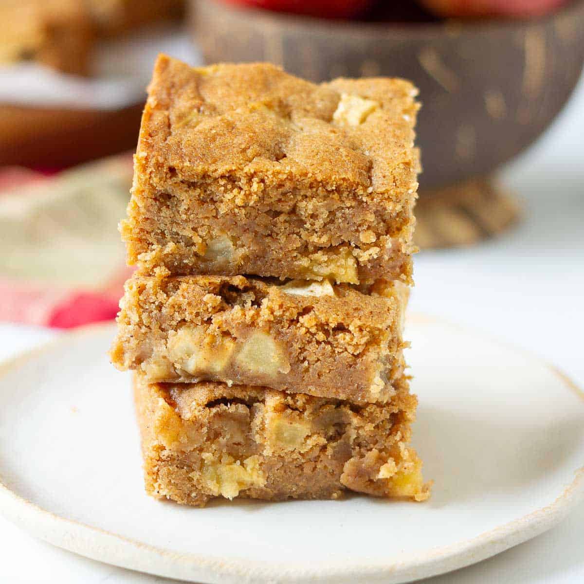 A stack of 3 blondies on a small plate.