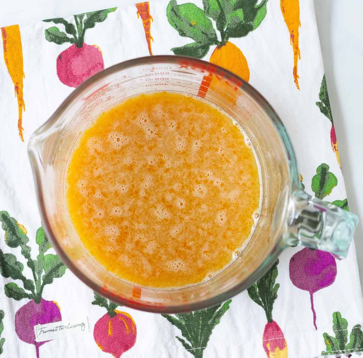 Wet ingredients in a glass measuring cup.