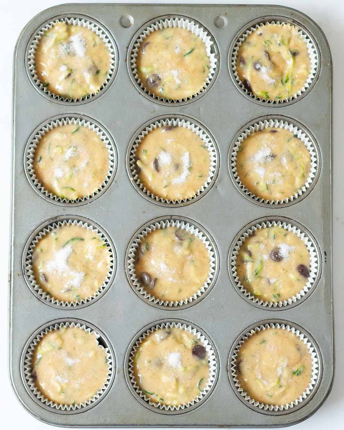 Muffin tray filled with batter.