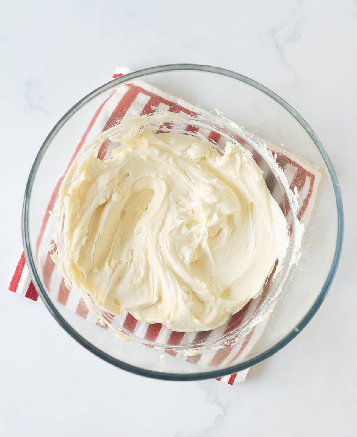 Cream cheese and sugar mixture in a mixing bowl.
