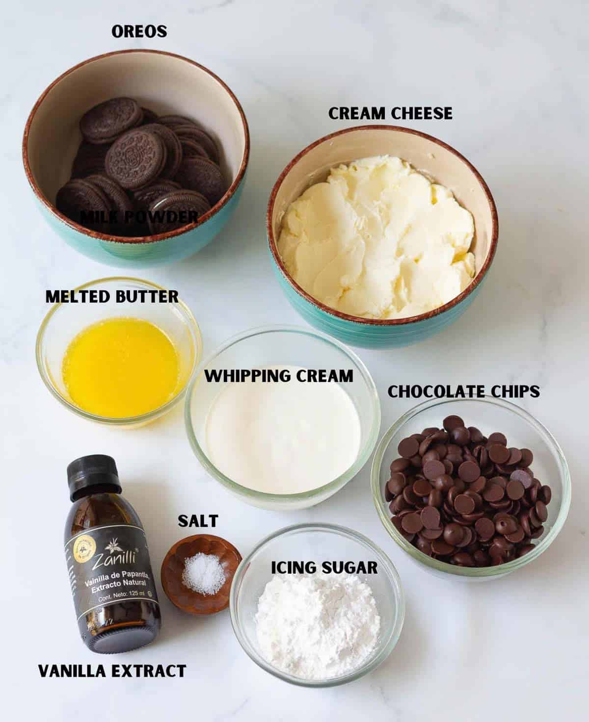 Labelled ingredients for making no-bake mini chocolate cheesecakes.