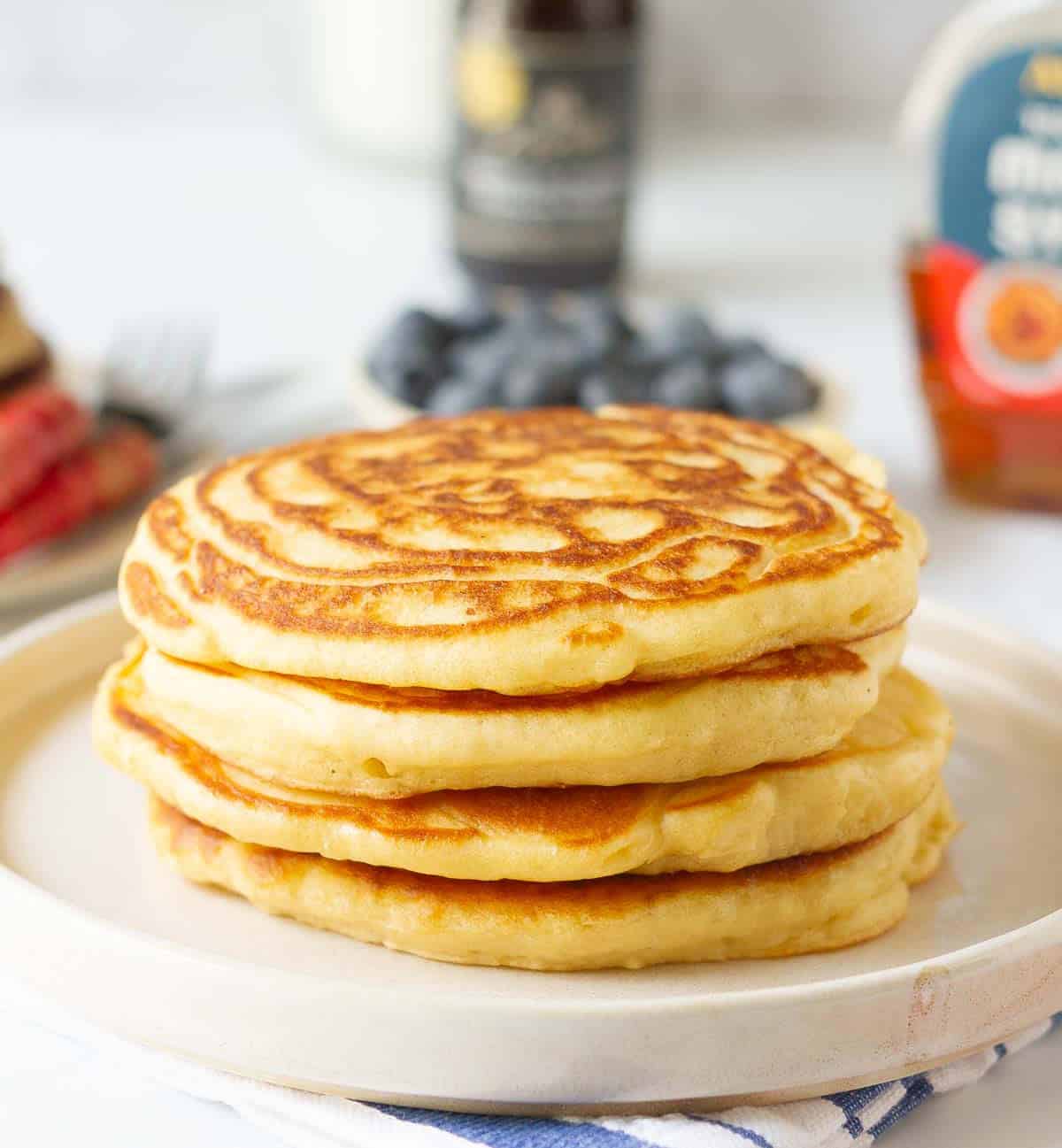 A stack of pancakes in a plate.