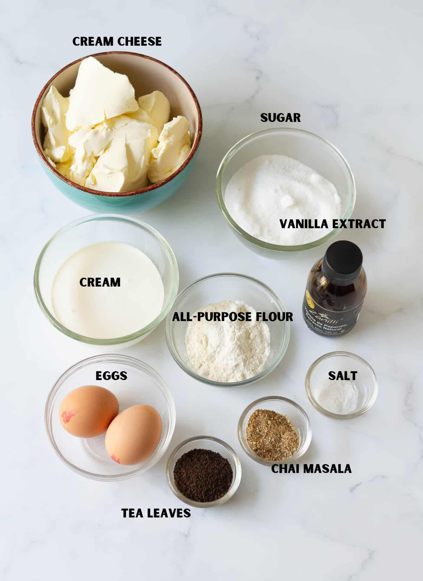 Labelled ingredients for making masala chai Basque cheesecake.